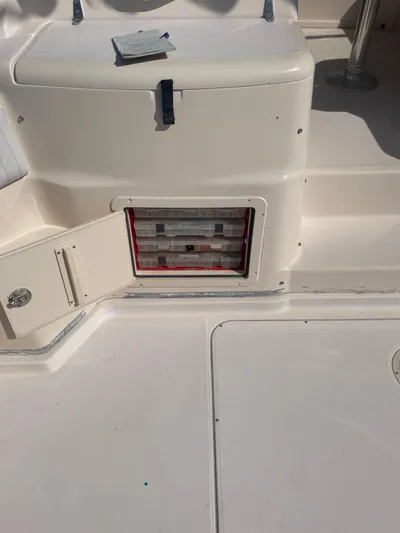 Working Girl Yacht Photos Pics 2008 Grady-White Open Express boat storage compartment with open hatch.