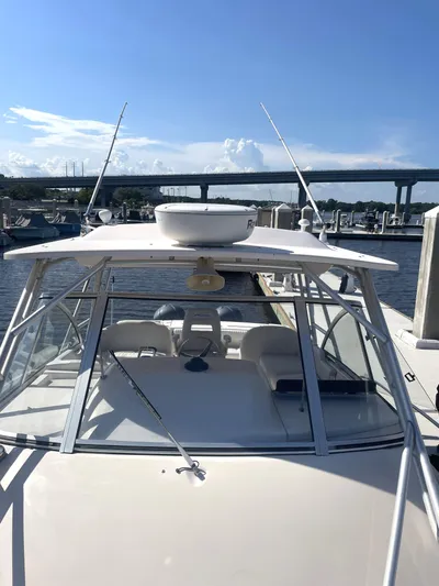 Working Girl Yacht Photos Pics 2008 Grady-White Open Express boat docked under clear blue sky.