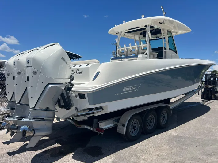  Yacht Photos Pics 2017 Boston Whaler 350 Outrage boat on trailer, featuring triple Mercury engines.