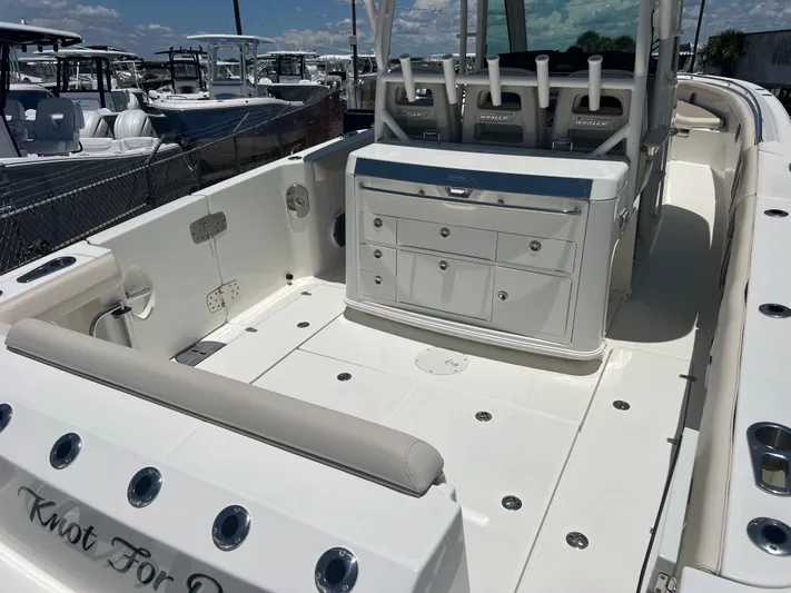  Yacht Photos Pics 2017 Boston Whaler 350 Outrage boat interior with seating and storage compartments.