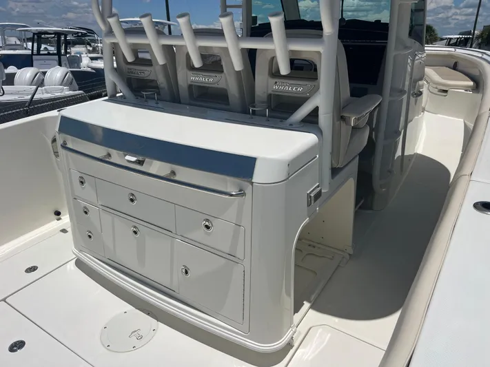  Yacht Photos Pics 2017 Boston Whaler 350 Outrage interior with seating and storage compartments.