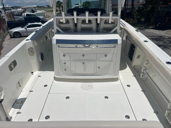  Yacht Photos Pics 2017 Boston Whaler 350 Outrage boat interior with seating and storage compartments.