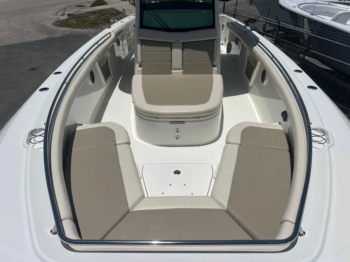  Yacht Photos Pics 2017 Boston Whaler 350 Outrage boat interior with beige seating and spacious layout.