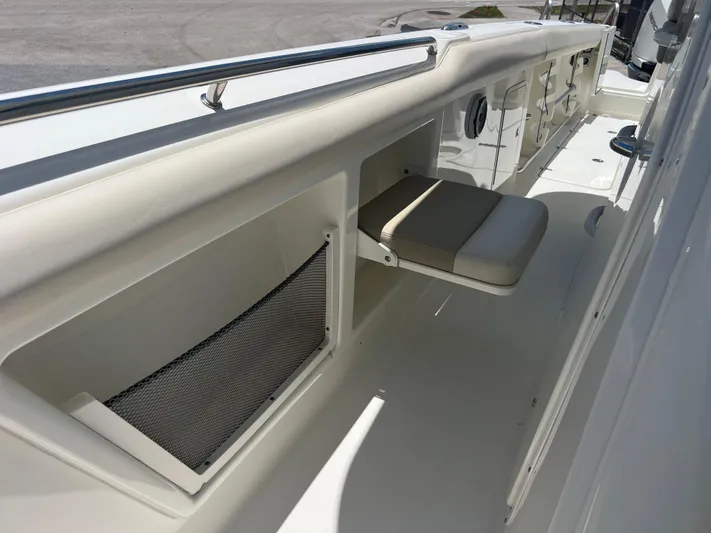  Yacht Photos Pics 2017 Boston Whaler 350 Outrage interior with seating and storage compartments.