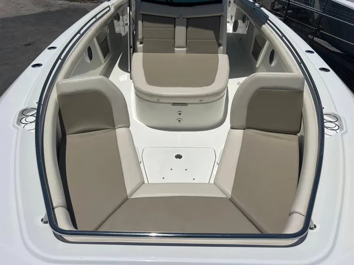  Yacht Photos Pics 2017 Boston Whaler 350 Outrage boat interior with beige seating and spacious layout.