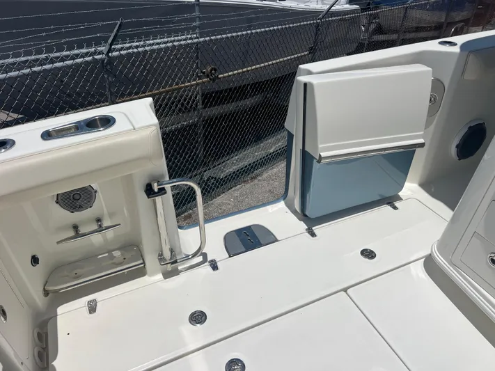 Yacht Photos Pics 2017 Boston Whaler 350 Outrage boat deck with seating and storage compartments.