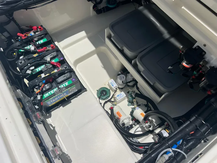  Yacht Photos Pics 2017 Boston Whaler 350 Outrage battery compartment with wiring and storage boxes.