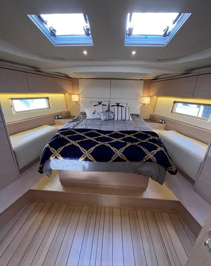 Hydrobaby3 Yacht Photos Pics Luxurious cabin interior of 2019 Beneteau Oceanis 51.1 yacht with skylights and elegant bedding.