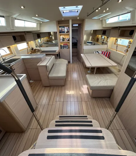 Hydrobaby3 Yacht Photos Pics Spacious interior of 2019 Beneteau Oceanis 51.1 yacht with modern furnishings and wood finish.
