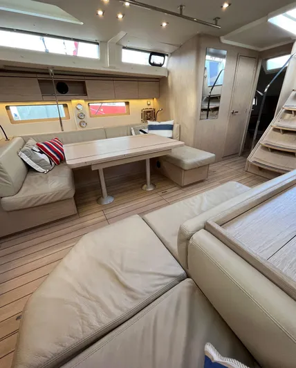 Hydrobaby3 Yacht Photos Pics Luxurious interior of 2019 Beneteau Oceanis 51.1 yacht with elegant seating and dining area.