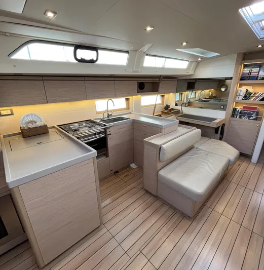 Hydrobaby3 Yacht Photos Pics Luxurious interior of 2019 Beneteau Oceanis 51.1 yacht with modern kitchen and seating area.