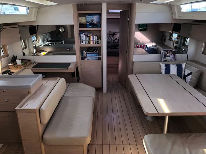 Hydrobaby3 Yacht Photos Pics Luxurious interior of 2019 Beneteau Oceanis 51.1 yacht with modern furnishings and ample natural light.