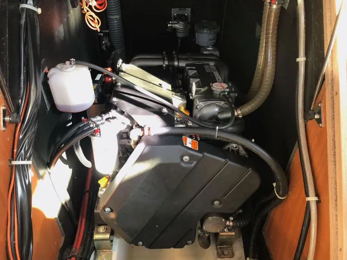 Hydrobaby3 Yacht Photos Pics Engine compartment of a 2019 Beneteau Oceanis 51.1 sailboat, showcasing mechanical components.