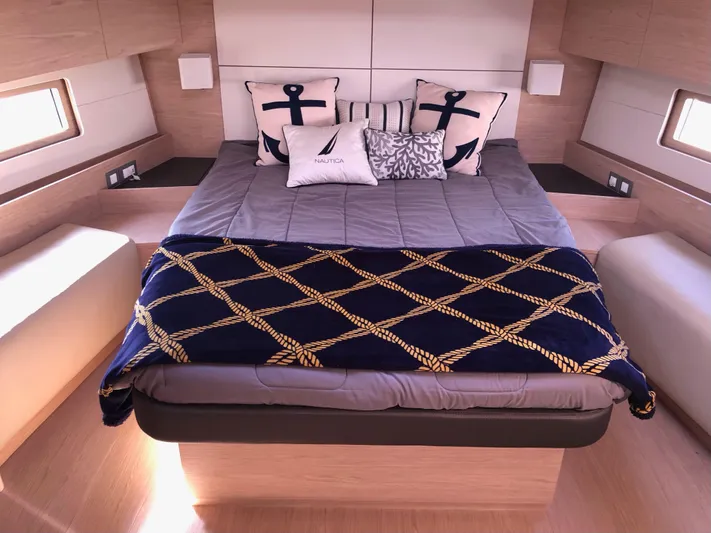 Hydrobaby3 Yacht Photos Pics Luxurious cabin interior of 2019 Beneteau Oceanis 51.1 yacht with nautical-themed bedding.