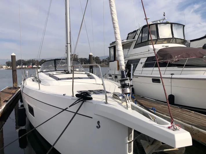 Hydrobaby3 Yacht Photos Pics 2019 Beneteau Oceanis 51.1 sailboat docked at marina, clear sky background.