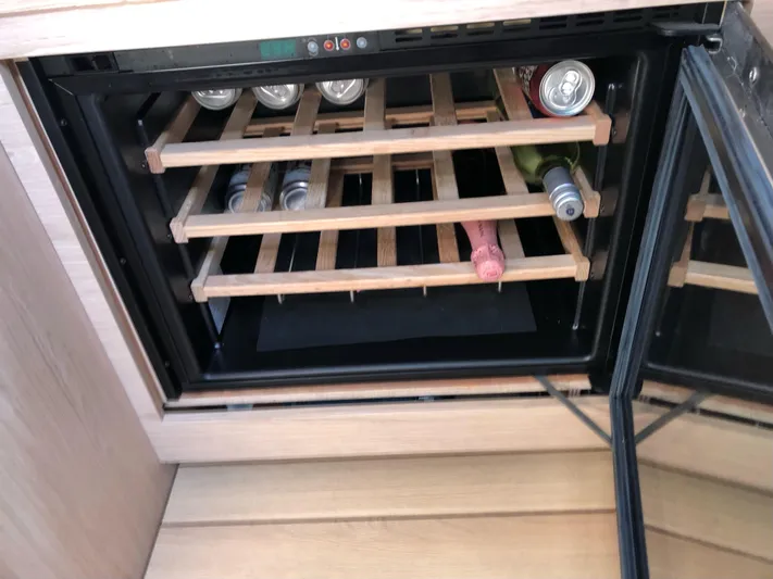 Hydrobaby3 Yacht Photos Pics Wine cooler with wooden racks on a 2019 Beneteau Oceanis 51.1 yacht.