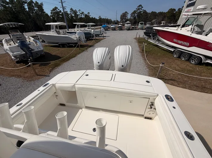  Yacht Photos Pics 2022 Regulator 28 boat on a lot with other boats.