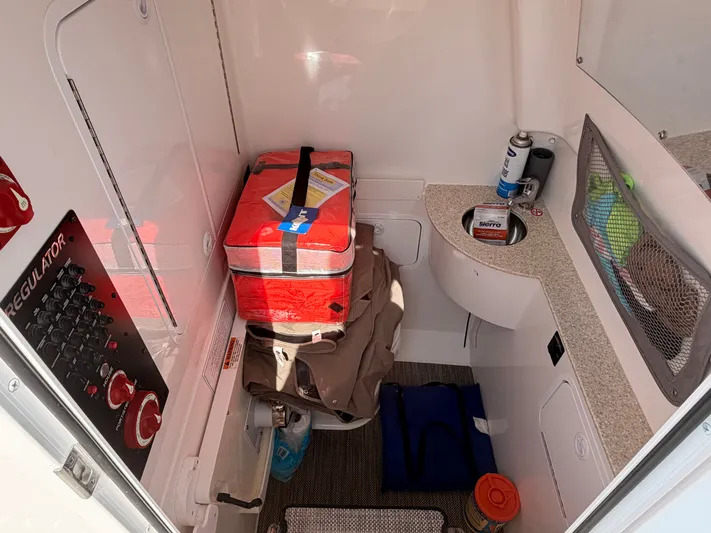  Yacht Photos Pics Interior of a 2022 Regulator 28 boat with storage and equipment.