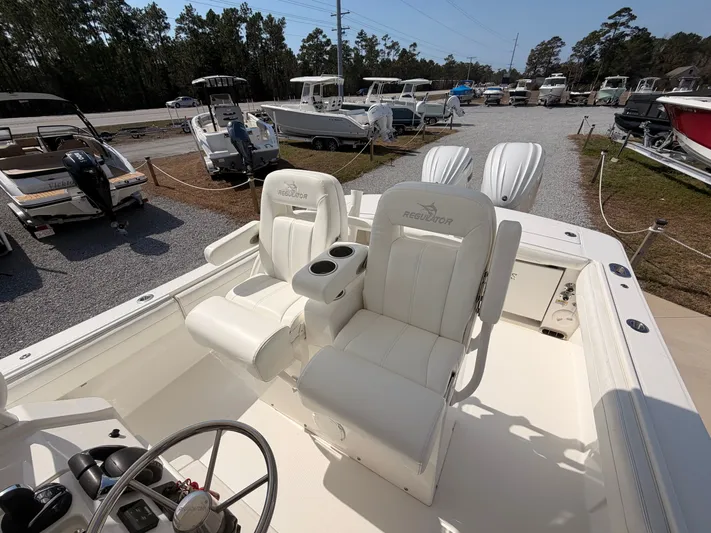  Yacht Photos Pics Interior view of a 2022 Regulator 28 boat with white seats.