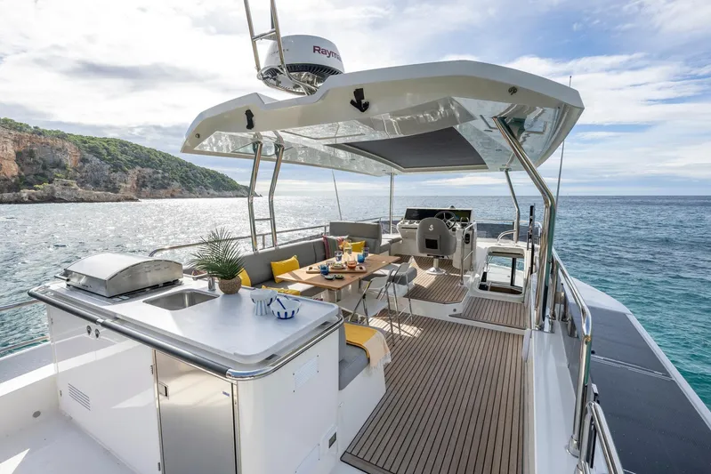  Yacht Photos Pics Luxurious 2025 Beneteau Swift Trawler 54 yacht with spacious deck and ocean view.