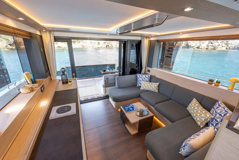  Yacht Photos Pics Luxurious interior of 2025 Beneteau Swift Trawler 54 with modern decor and ocean view.