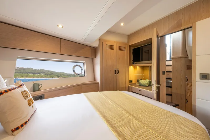  Yacht Photos Pics Luxurious cabin interior of 2025 Beneteau Swift Trawler 54 with scenic window view.