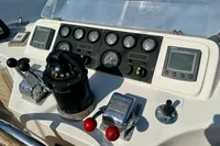 Control panel of a 1990 Trader 41 + 2 Sundeck boat with gauges and navigation instruments.