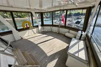 Spacious 1990 Trader 41 + 2 Sundeck with wooden flooring and panoramic windows.