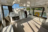 1990 Trader 41 + 2 Sundeck yacht interior with spacious deck and scenic water view.