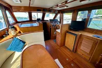 Interior of 1990 Trader 41 + 2 Sundeck yacht with wood finish and modern amenities.