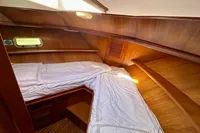 Cozy cabin interior of 1990 Trader 41 + 2 Sundeck yacht with wooden finish.