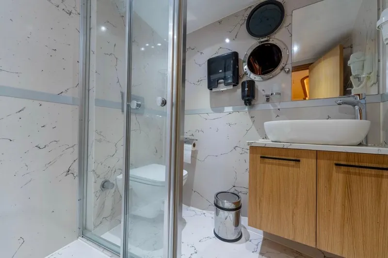  Yacht Photos Pics Luxurious bathroom on 2022 Gulet 24m yacht with modern fixtures and marble design.