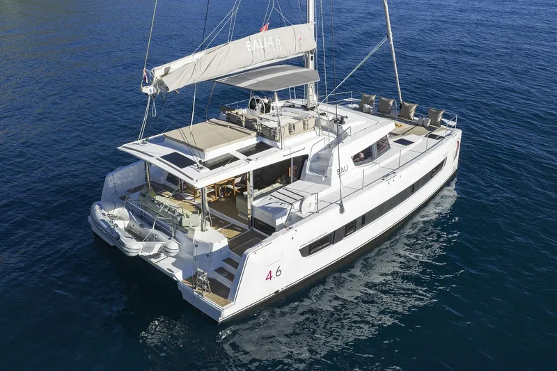 Belle Amie Yacht Photos Pics 2025 Bali 4.6 catamaran sailing on calm blue waters, showcasing luxury and spacious design.