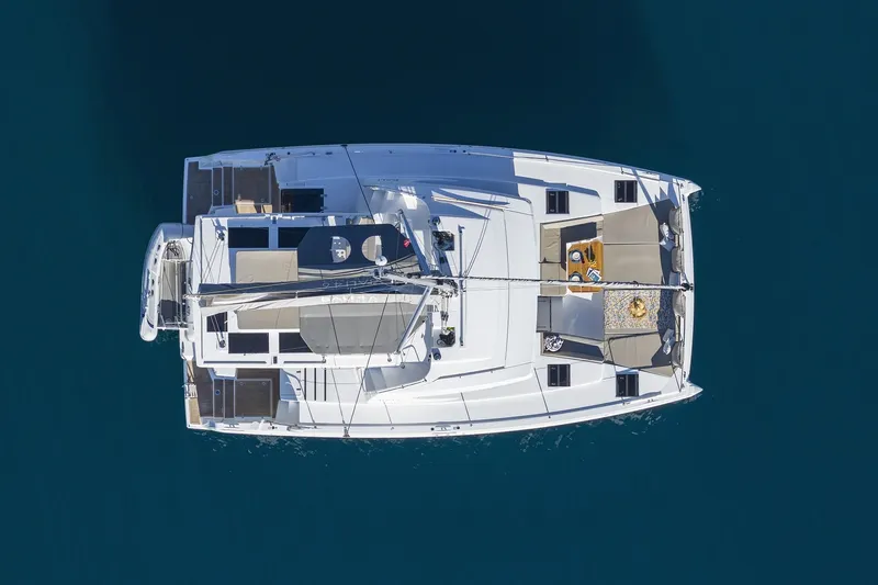 Belle Amie Yacht Photos Pics Aerial view of 2025 Bali 4.6 catamaran on calm blue water.