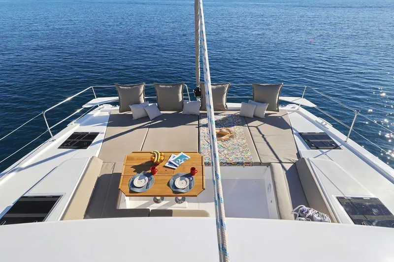 Belle Amie Yacht Photos Pics Luxurious Bali 4.6 yacht deck with sun loungers and dining setup, 2025 model.