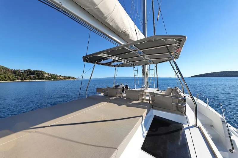 Belle Amie Yacht Photos Pics Luxurious 2025 Bali 4.6 yacht with spacious deck, sailing on serene blue waters.