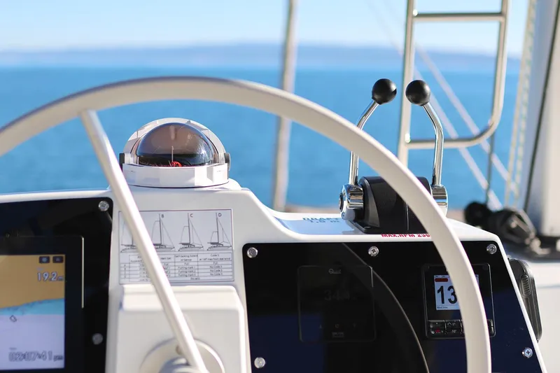 Belle Amie Yacht Photos Pics Steering wheel and controls of 2025 Bali 4.6 yacht with ocean view.