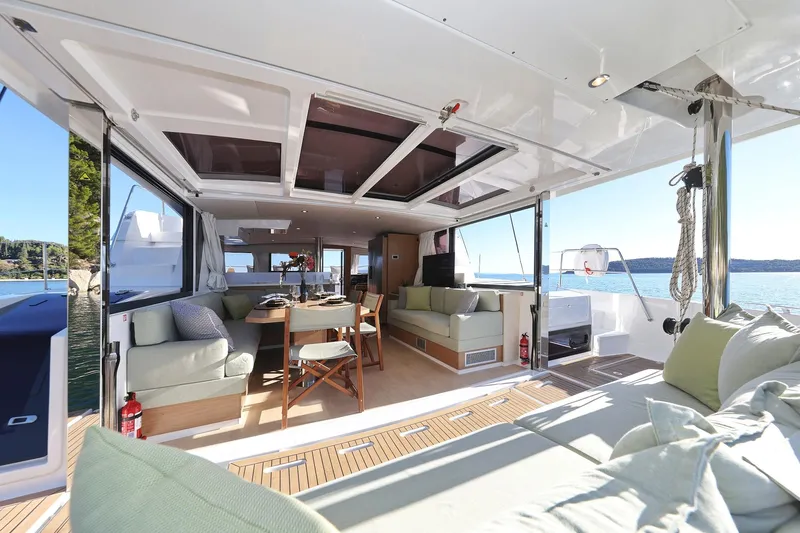 Belle Amie Yacht Photos Pics Luxurious Bali 4.6 yacht interior, 2025 model, featuring spacious seating and dining area.