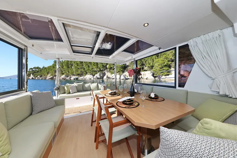 Belle Amie Yacht Photos Pics Luxurious interior of 2025 Bali 4.6 yacht with elegant dining area and scenic ocean view.