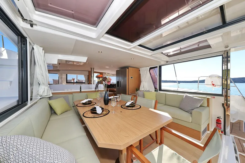 Belle Amie Yacht Photos Pics Luxurious interior of 2025 Bali 4.6 yacht with elegant dining area and scenic ocean view.