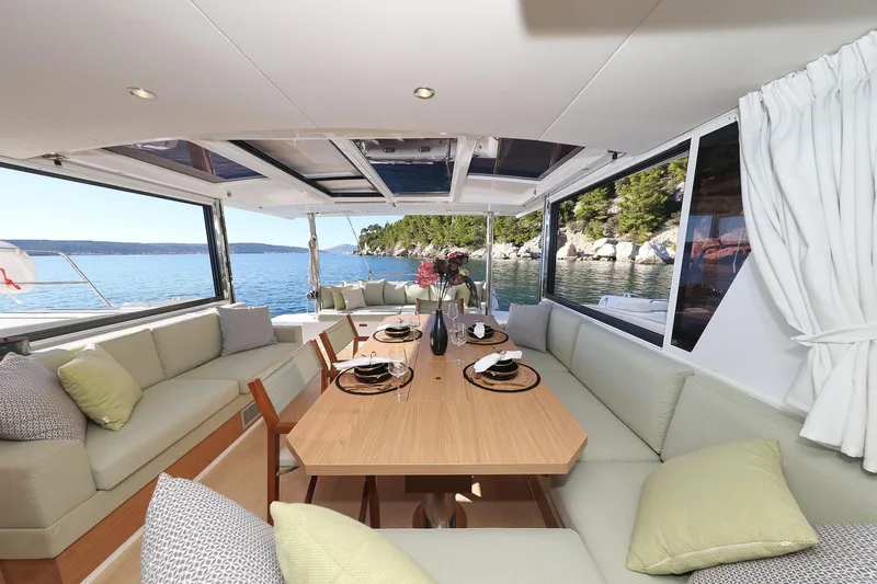 Belle Amie Yacht Photos Pics Luxurious interior of 2025 Bali 4.6 yacht with elegant dining area and scenic ocean view.