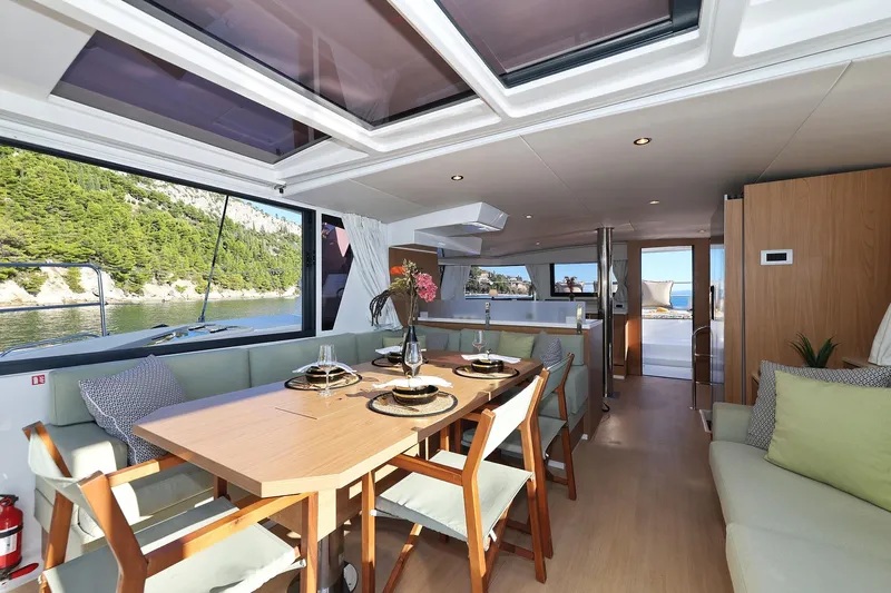Belle Amie Yacht Photos Pics Luxurious interior of 2025 Bali 4.6 yacht with elegant dining area and scenic views.