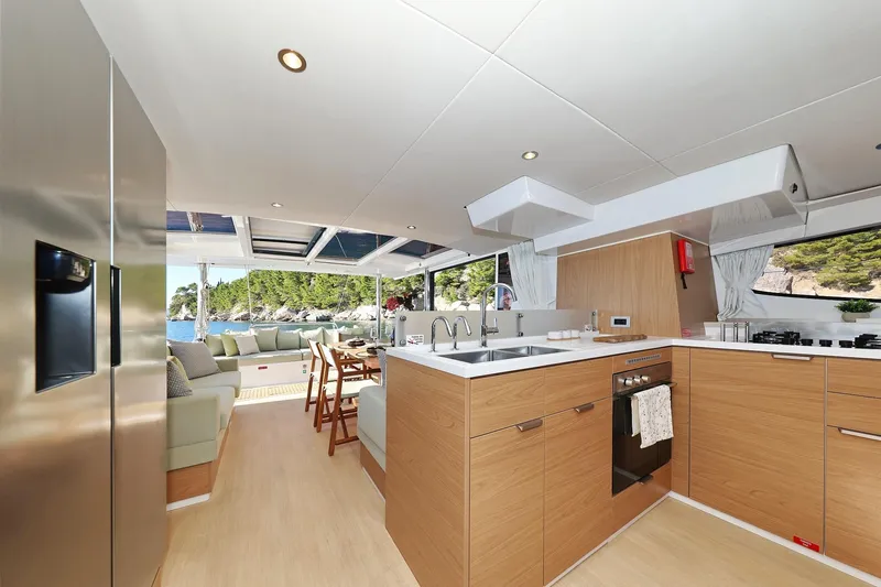 Belle Amie Yacht Photos Pics Luxurious 2025 Bali 4.6 yacht interior with modern kitchen and scenic ocean view.