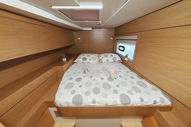 Belle Amie Yacht Photos Pics Luxurious cabin interior of 2025 Bali 4.6 yacht with modern wooden design.