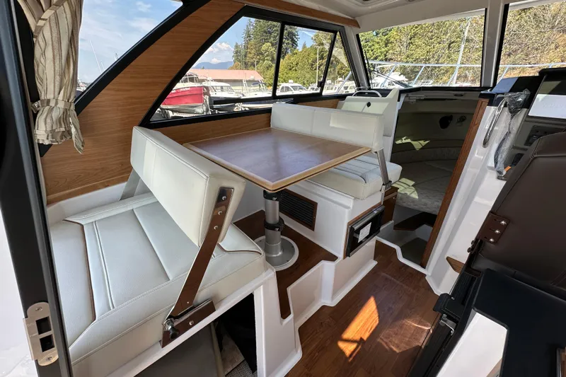  Yacht Photos Pics Interior of 2026 Cutwater C-248 Coupe boat with seating and table.