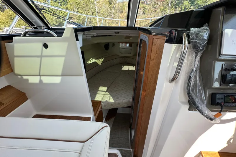  Yacht Photos Pics 2026 Cutwater C-248 Coupe interior cabin with bed and control panel.