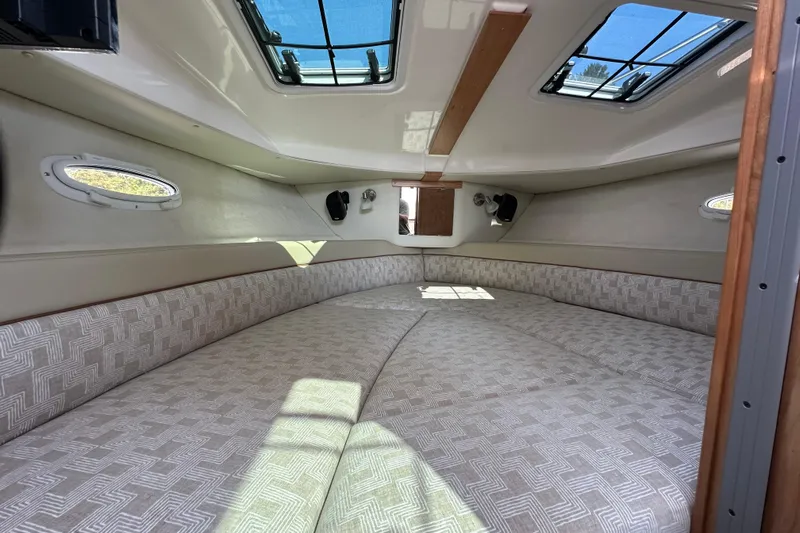  Yacht Photos Pics 2026 Cutwater C-248 Coupe cabin interior with spacious bed and skylights.