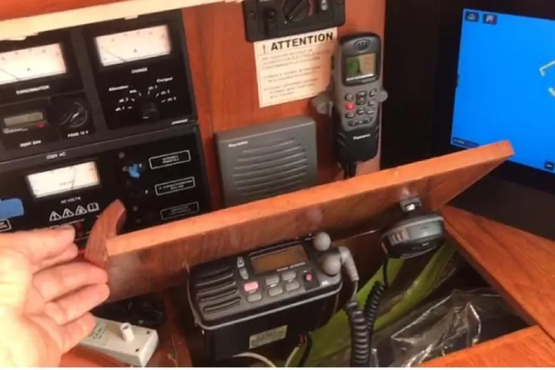 4 Estrellas Yacht Photos Pics Control panel of a 2006 Jeanneau Sun Odyssey 49 DS sailboat with communication equipment.