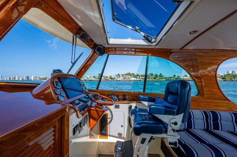 Gracious Yacht Photos Pics Interior of 2018 Hinckley Picnic Boat 37 MKIII with luxurious seating and navigation controls.