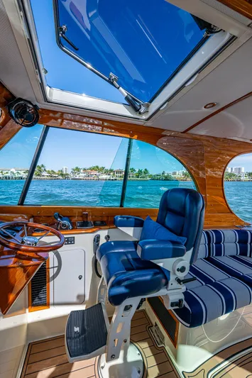Gracious Yacht Photos Pics Interior of 2018 Hinckley Picnic Boat 37 MKIII with blue seating and ocean view.
